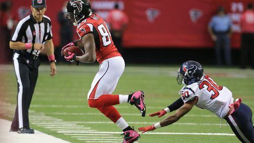 Roddy White with a catch last season. He didn't have all that many. (Curtis Compton/AJC)