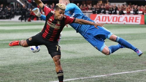Atlanta United forward Josef Matinez has a header blocked by D.C. United goal keeper during the second half in a MLS soccer match on Sunday, March 11, 2018, in Atlanta. Atlanta United won the game 3-1.    Curtis Compton/ccompton@ajc.com