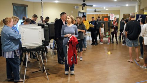 A steady steam of people vote at the St Mary's Orthodox Church in Roswell, Ga., Tuesday, Nov. 6, 2018. (Bob Andres/Atlanta Journal-Constitution via AP)
