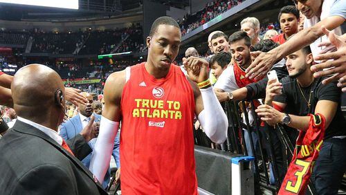 Dejected Atlanta Hawks Dwight Howard, who did not play in the fourth quarter, leaves the court falling 115-99 to the Washington Wizards in Game 6 of a first-round NBA basketball playoff series on Friday, April 28, 2017, in Atlanta. Curtis Compton/ccompton@ajc.com