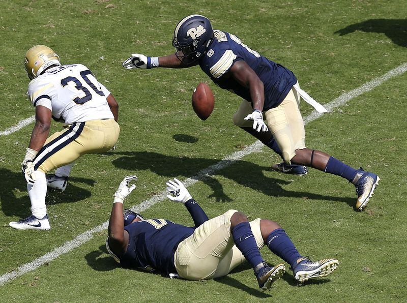 ATLANTA, GA - SEPTEMBER 23:  Running back KirVonte Benson #30 of the Georgia Tech Yellow Jackets fumbles in the second half during the game against the  the Pittsburgh Panthers at Bobby Dodd Stadium on September 23, 2017 in Atlanta, Georgia.  (Photo by Mike Zarrilli/Getty Images)