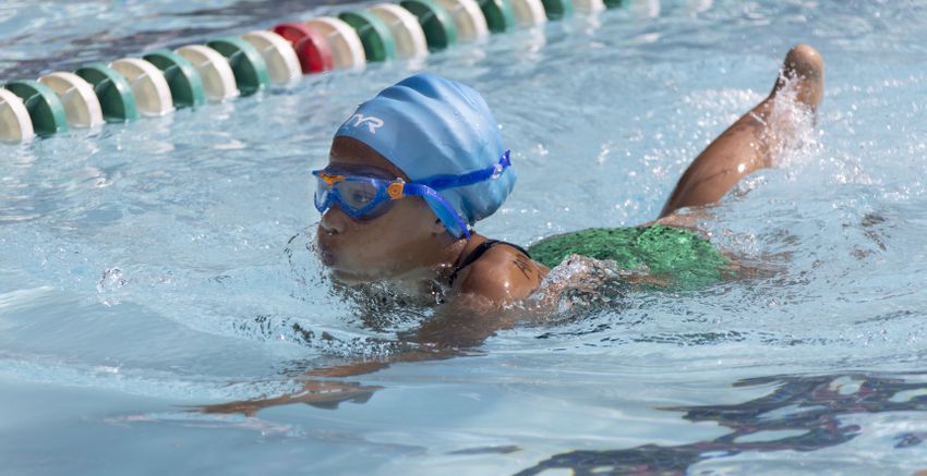 Ava Middlebrook , 8, competes in the breast stroke in a swim meet at Leslie Beach Club in Atlanta on Saturday, May 21, 2022.    According to the USA Swimming Foundation, while most Americans learn how to swim during childhood, 64% of Black children in America have little to no swimming ability. (Bob Andres / robert.andres@ajc.com)