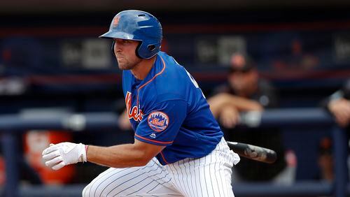 New York Mets' Tim Tebow make contact during a spring training baseball game against the Miami Marlins Monday, March 13, 2017, in Port St. Lucie, Fla.