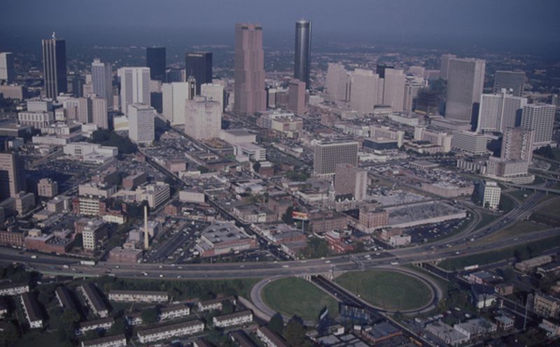 The construction of the Downtown Connector divided downtown Atlanta  from the historic Sweet Auburn neighborhood (at the bottom of the photo), which was the cultural and business center for African Americans in Atlanta. Photo by Cotten Alston, Courtesy of Kenan Research Center at the Atlanta History Center.