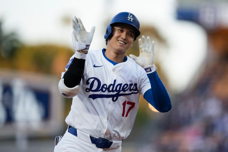 Los Angeles Dodgers two-way player Shohei Ohtani runs the bases after hitting a home run during the first inning of a baseball game against the Miami Marlins in Los Angeles, Monday, May 6, 2024. Mookie Betts also scored. (AP Photo/Ashley Landis)