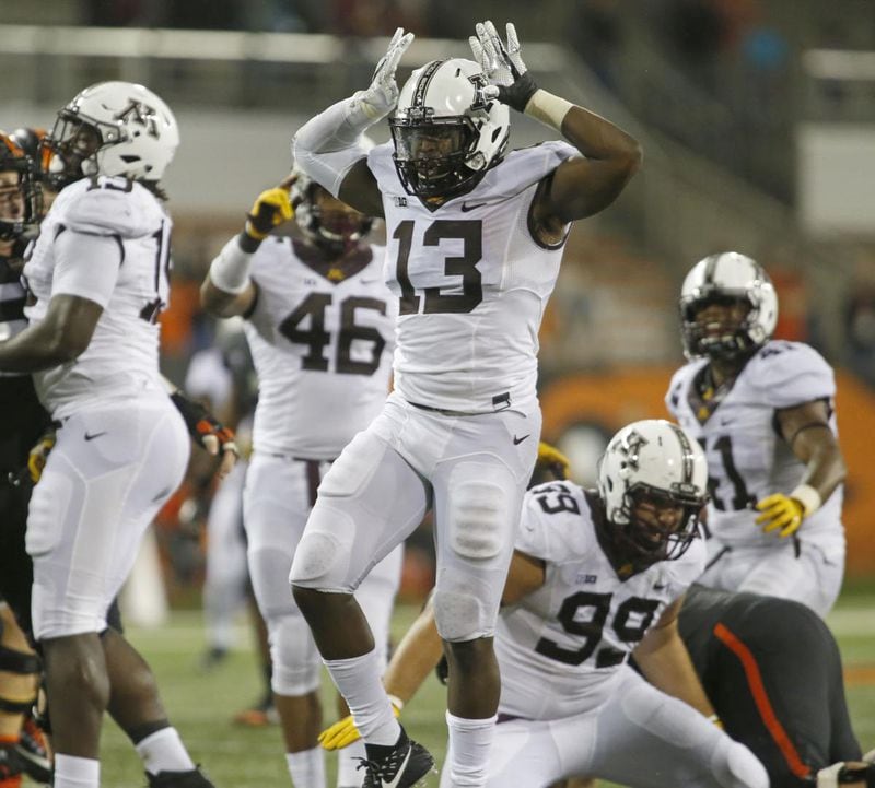 Minnesota linebacker Jonathan Celestin celebrates after making a tackle for a loss during the second half against Oregon State. (Associated Press)