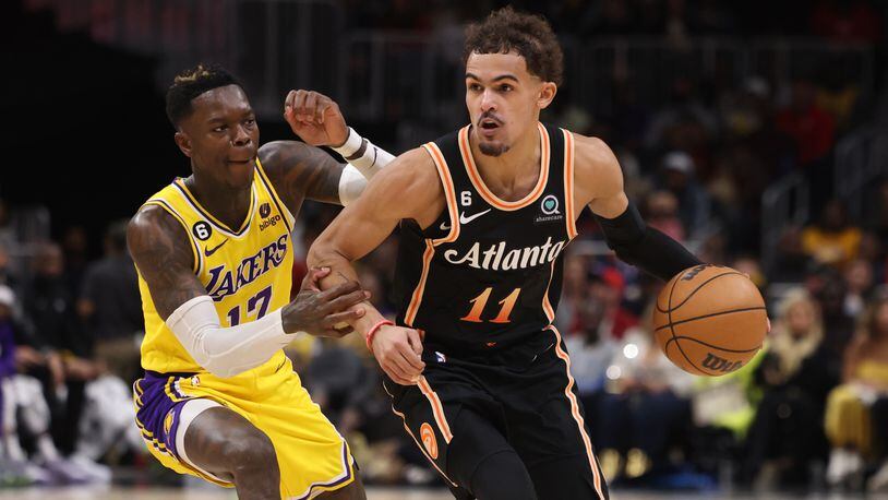 Hawks guard Trae Young drives against Lakers guard Dennis Schroder (17) during the second half at the Hawks-Lakers game Dec. 30, 2022 at State Farm Arena. (Jason Getz/jason.getz@ajc.com).