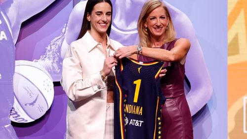 Caitlin Clark (left) poses with WNBA Commissioner Cathy Engelbert after being selected as the first overall pick by the Indiana Fever during the 2024 WNBA draft at Brooklyn Academy of Music on Monday, April 15, 2024, in New York City. (Sarah Stier/Getty Images/TNS)
