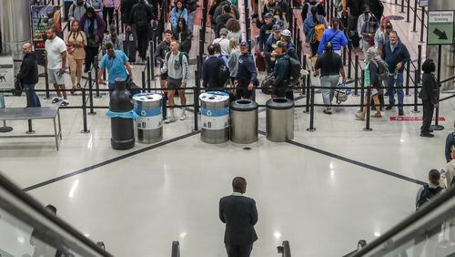 May 25, 2023 Hartsfield-Jackson International Airport: Reports of COVID-19 cases are at a low for the year in Georgia so few are masking as they pass through Hartsfield-Jackson International Airport in advance of the Memorial Day weekend. (John Spink / John.Spink@ajc.com)