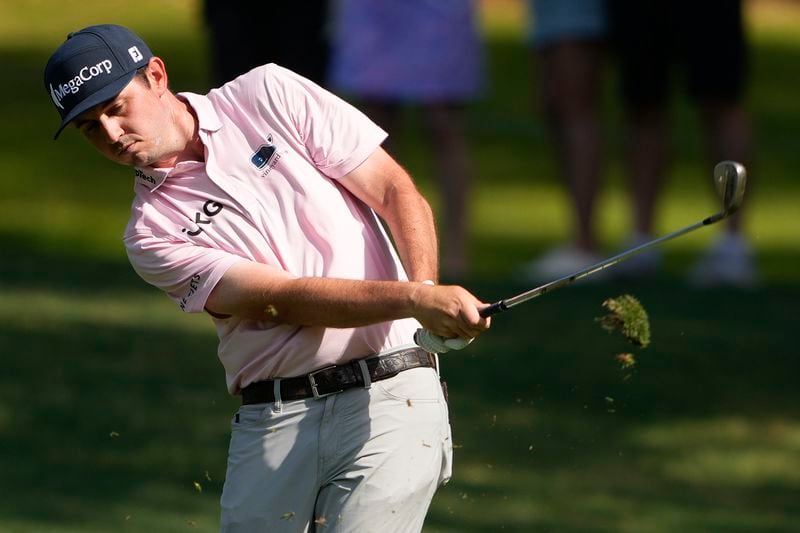 J.T. Poston hits from the fairway on the first hole during the first round of the RBC Heritage golf tournament, Thursday, April 18, 2024, in Hilton Head, S.C. (AP Photo/Chris Carlson)