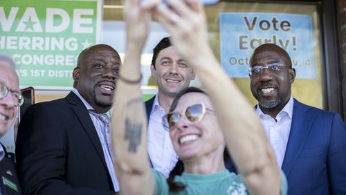 Savannah Mayor Van Johnson, left, poses for a selfie photo with U.S. Sens. Jon Ossoff, center, and Raphael Warnock ahead of the 2022 election. (AJC Photo/Stephen B. Morton)
