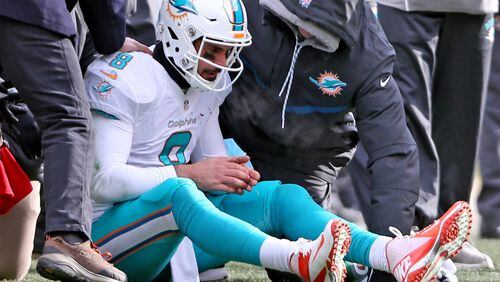 Miami Dolphins quarterback Matt Moore sits on the field after being hit by Pittsburgh Steelers' Bud Dupree in the second quarter in the NFL Wild Card Playoffs on Sunday, Jan. 8, 2017 at Heinz Stadium in Pittsburgh, Pa. (Charles Trainor Jr./Miami Herald/TNS)