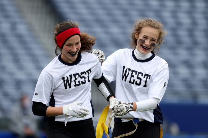 West Forsyth's Haylee Dornan, left, and Caroline Coggin celebrate an interception by Dornan against Hillgrove during the first half of the Class 6A-7A Flag Football championship at Center Parc Stadium Monday, December 28, 2020 in Atlanta, Ga.. JASON GETZ FOR THE ATLANTA JOURNAL-CONSTITUTION