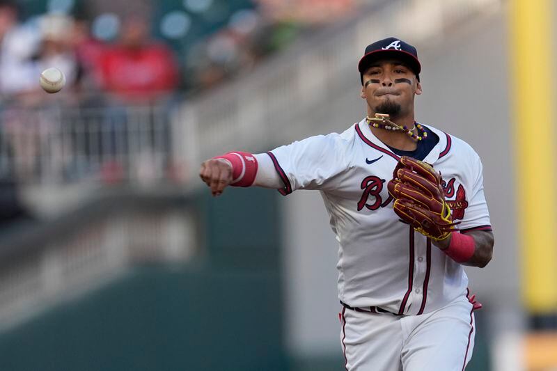 Atlanta Braves shortstop Orlando Arcia throws to first base to retire Miami Marlins' Luis Arraez after fielding a ground ball in the first inning of a baseball game Tuesday, April 23, 2024, in Atlanta. (AP Photo/John Bazemore)