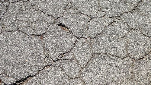 Decatur’s commission recently approved seven streets for milling, patching, repairing and resurfacing in 2017. The priority list is largely determined by the “Road Surface Management Pavement Condition Evaluations System,” also used by the Georgia Department of Transportation, or if a street looks like this. Bill Banks file photo for the AJC