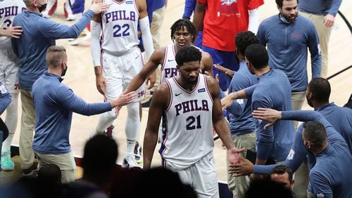 76ers center Joel Embiid and teammates leave with a 104-99 victory over the Atlanta Hawks in Game 6 of their NBA Eastern Conference semifinals series.   “Curtis Compton / Curtis.Compton@ajc.com”