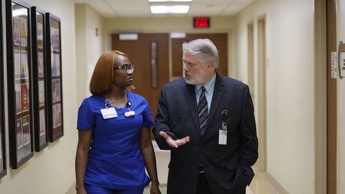 Executive Medical Director at Willowbrooke, Dr. Kenneth Genova, talks with nurse Kirsten Felton in one of the hallways of the clinic on Monday, September 18, 2022. Miguel Martinez / miguel.martinezjimenez@ajc.com 