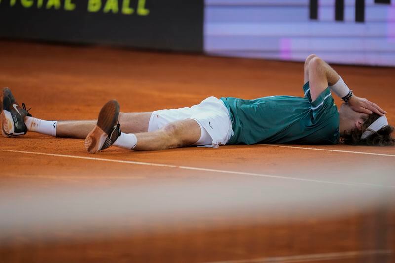 Andrey Rublev, of Russia, celebrates after winning the final match against Felix Auger-Aliassime, of Canada, at the Madrid Open tennis tournament in Madrid, Spain, Sunday, May 5, 2024. (AP Photo/Manu Fernandez)