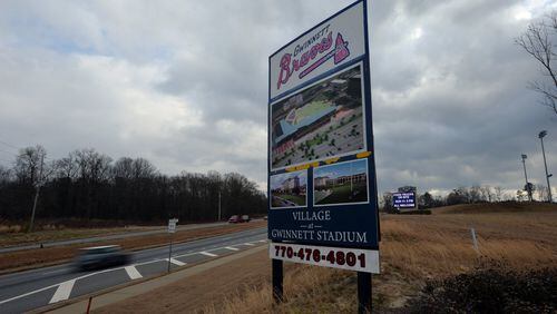 This file picture shows Coolray Field (right) and surrounding area along Buford Drive in Lawrenceville on Tuesday, January 21, 2014. In 2008, developer Brand Morgan announced plans for 351,000 square feet of retail space, 617,000 square feet of offices, 610 residential units and 300 hotel rooms to be built adjacent to the stadium on Buford Drive. Thus far, 658 apartments have been built.