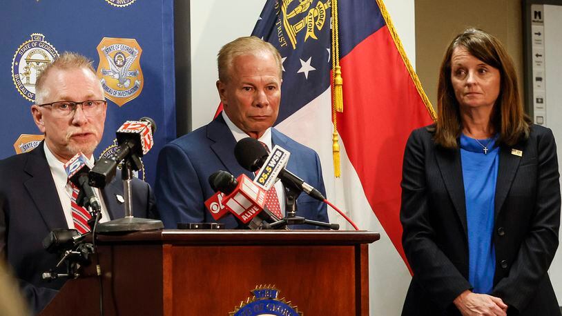 (Left to right) Joe Montgomery, Special Agent in Charge for  Georgia Bureau of Investigation answers questions as GBI Director Michael Register and Keri Farley, FBI Special Agent in Charge look on during a press conference updating details on a 33 year old Dade County cold case on Tuesday, September 6, 2022. (Natrice Miller/ natrice.miller@ajc.com)