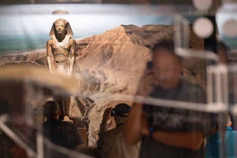 Visitors attend the “Tutankhamun: His Tomb and His Treasures” exhibit at Exhibition Arts Center Atlanta in Doraville on Wednesday, October 4, 2023. (Arvin Temkar / arvin.temkar@ajc.com)