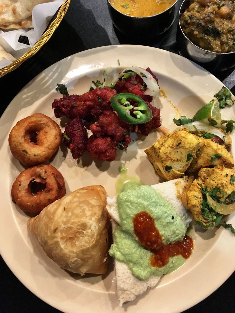 The myriad buffet options can create a messy but colorful spread at your table at Bollywood Zing. CONTRIBUTED BY WYATT WILLIAMS