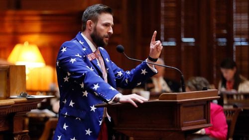 3/29/18 - Atlanta - Rep. David Clark, R - Buford, speaks in support of the house amended version of HB 65, related to THC Oil, which passed. He also quoted Captain America. Clark has worn the patriotic colors on all of his past Sine Die sessions Thursday was the 40th and final day of the 2018 General Assembly. BOB ANDRES /BANDRES@AJC.COM