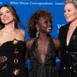 Actress Sophia Bush, White House Press Secretary Karine Jean-Pierre and former football player Ashlyn Harris, poses for photographers as they arrives at the annual White House Correspondents' Association Dinner in Washington, Saturday, April 27, 2024. (AP Photo/Jose Luis Magana)