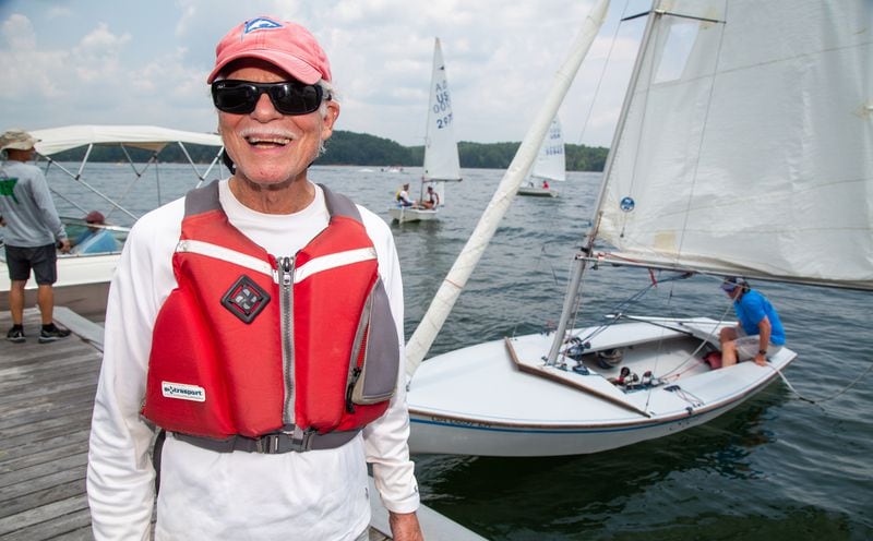 John Muhlhausen, age 81, is celebrating 75 years of sailing. He has been a member of the Atlanta Yacht Club on Lake Allatoona for 52 years. He has taught plenty of youth how to sail, including his son & is now teaching his 7-year-old granddaughter. She will be the sixth generation of sailors in the family. PHIL SKINNER FOR THE ATLANTA JOURNAL-CONSTITUTION.
