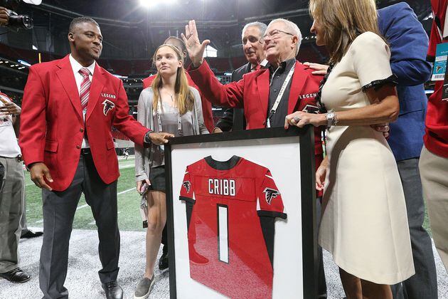 September 30, 2018 Atlanta: Falcons long time team photographer Jimmy Cribb is honored by owner Arthur Blank and former running back Warrick Dunn with a team jersey before playing the Bengals in a NFL football game on Sunday, Sept 30, 2018, in Atlanta.   Curtis Compton/ccompton@ajc.com