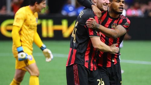 May 12, 2019 Atlanta: Atlanta United midfielder Julian Gressel (left) celebrates his apparent goal past Orlando City goalkeeper Brian Rowe (left) with Josef Martinez during the second half in a MLS soccer match on Sunday, May 12, 2019, in Atlanta. The goal was taken off the board after review, but Atlanta United held on to win the game 1-0. Curtis Compton/ccompton@ajc.com