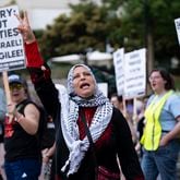 Jawahir Kamil, who is from Jerusalem, chants along during a protest against the war in Gaza on the Emory campus on Tuesday, April 30, 2024.   (Ben Gray / Ben@BenGray.com)