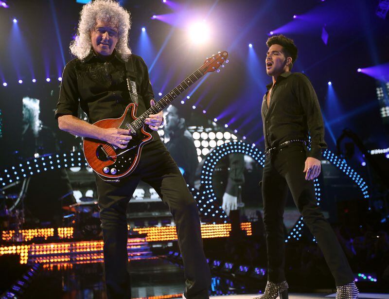  LAS VEGAS, NV - SEPTEMBER 20: Brian May of Queen (L) and Adam Lambert perform onstage during the iHeartRadio Music Festival at the MGM Grand Garden Arena on September 20, 2013 in Las Vegas, Nevada. (Photo by Christopher Polk/Getty Images for Clear Channel)