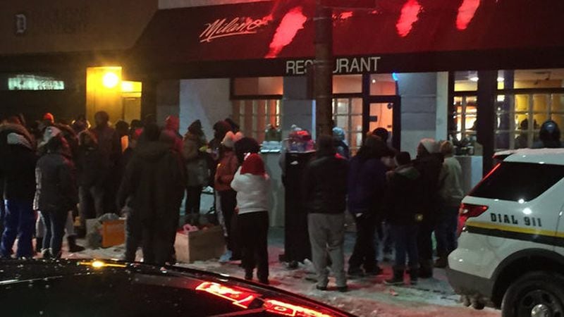 People protested outside of Pizza Milano following a violent altercation between the owner and a woman Friday.  (Photo: WPXI.com)