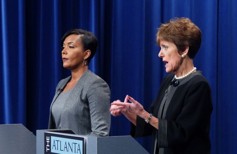 Atlanta Mayoral Candidate Mary Norwood (right) speaks as her opponent Keisha Lance Bottoms listens during the Atlanta Press Club Loudermilk-Young Debate Series. The runoff election will be held Dec. 5, 2017. HYOSUB SHIN / HSHIN@AJC.COM
