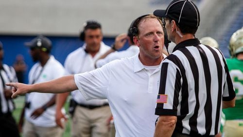 Buford High School head coach John Ford argues with a referee during the 2018  Corky Kell Classic Friday, Aug.17, 2018, at Georgia State Stadium in Atlanta.