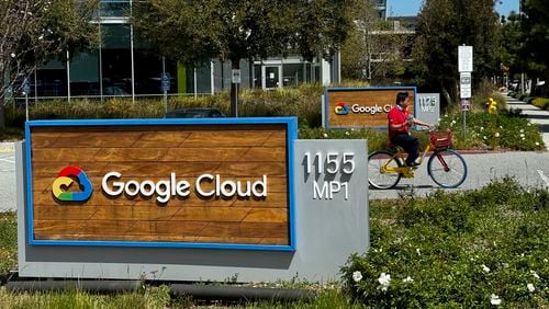 A person rides past the Google sign outside the Google offices in Sunnyvale, Calif., on Thursday, April 18, 2024. Google has fired 28 employees who were involved in protests over the tech company’s cloud computing contract with the Israeli government. The workers held sit-ins at the company’s offices in California and New York over Google’s $1.2 billion contract to provide custom tools for Israeli’s military. (AP Photo/Terry Chea)