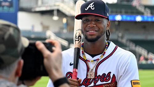 Atlanta Braves right fielder Ronald Acuña Jr. poses for team photographer Kevin D. Liles during the team's photo day at CoolToday Park, Friday, Feb. 23, 2024, in North Port, Florida. (Hyosub Shin / Hyosub.Shin@ajc.com)