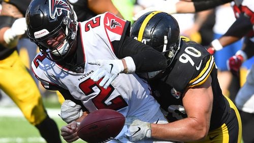 Falcons QB Matt Ryan fumbles as he is hit by T.J. Watt during Sunday's 41-17 Steelers victory in Pittsburgh.