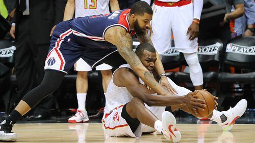 Atlanta Hawks’ Paul Millsap wins the battle for a lose ball with Washington Wizards’ Markieff Morris in Game 4 of a first-round NBA basketball playoff series on Monday, April 24, 2017, in Atlanta. Curtis Compton/ccompton@ajc.com