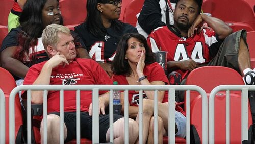 Falcons fans sit dejected in the stands after an overtime loss to the Saints at Mercedes-Benz Stadium on Sept. 23.