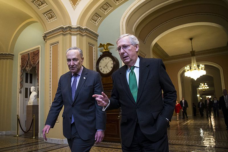 Senate Majority Leader Mitch McConnell (R-Ky.), right, and Senate Minority Leader Chuck Schumer (D-N.Y.) walk to the Senate floor in Washington, D.C. Two out of every three Georgia voters say they have lost confidence in the ability of Republicans and Democrats in Congress to work together, according to an AJC poll. (Al Drago photo)