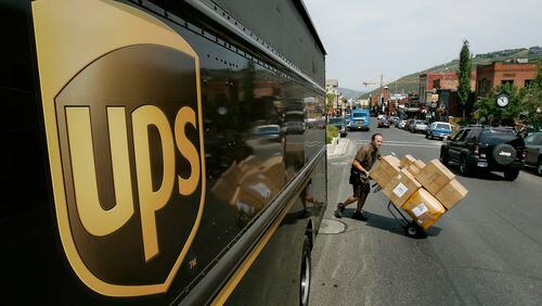 A UPS driver delivers packages. (AP Photo/Douglas C. Pizac, File)