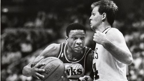 Glenn Rivers of the Atlanta Hawks tries to drive past Danny Ainge of the Boston Celtics in the second quarter of Game 1 in the second round of the NBA playoffs Wednesday night in the Boston Garden. AJC file/William Berry