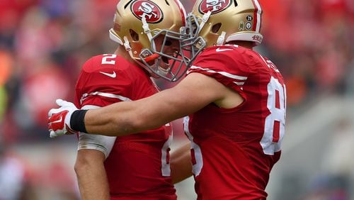 San Francisco tight end Garrett Celek and quarterback Blaine Gabbert celebrate after Celek caught his second touchdown pass against the Falcons in the second quarter Sunday at Levi's Stadium. (Getty Images)