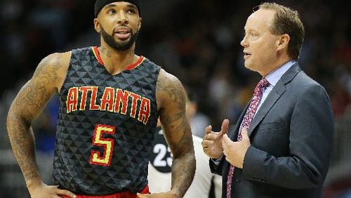 Hawks guard Mike Delaney and coach Mike Budenholzer. (Curtis Compton/ccompton@ajc.com)