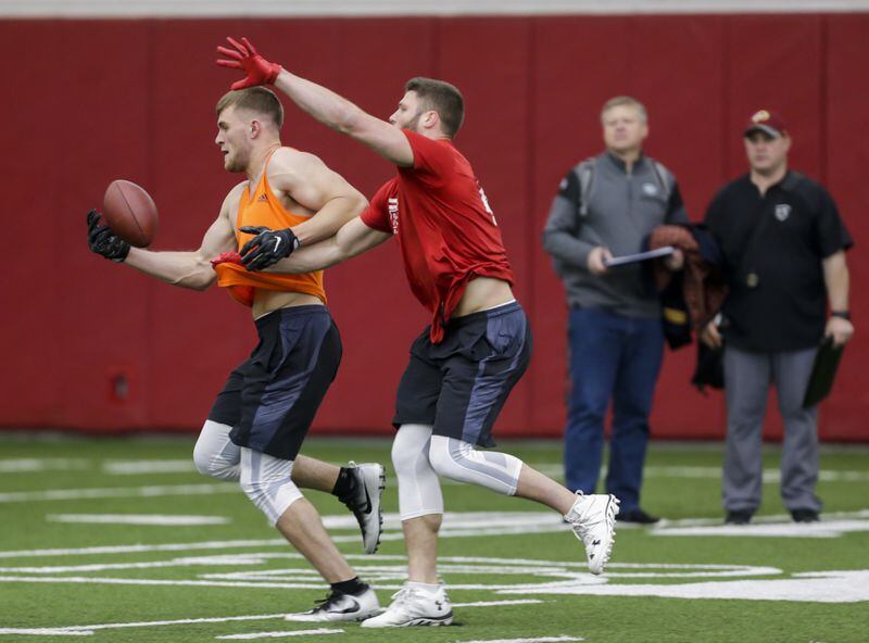  Former Wisconsin linebacker T.J. Watt, left, makes a reception against former Wisconsin linebacker Vince Biegel during drills at Wisconsin's Pro Day Wednesday, March 15, 2017, in Madison, Wis. (AP Photo/Andy Manis)