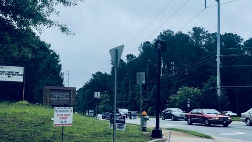 Signs direct Dekalb County voters into Mary Mcleod Bethune Middle School for Election Day.