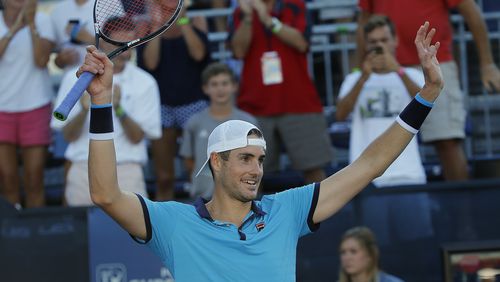 Former UGA player John Isner gestures to the crowd after defeating Ryan Harrison in the finals of the Atlanta Open tennis tournament Sunday, July 30, 2017, in Atlanta.