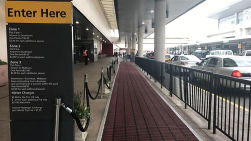 The "red carpet" for taxi customers at the taxi pick-up area outside the west exit of the domestic terminal at Hartsfield-Jackson